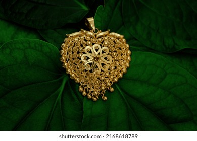 golden locket photo with leaf