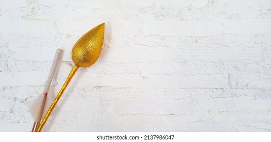 Golden Lotus Or Water Lily With Incense And Gold Foil Paper For Worshiping Buddha Isolate On White Wall Background At  Thai Temple. Religious Beliefs Of Buddhists Or Asian People 