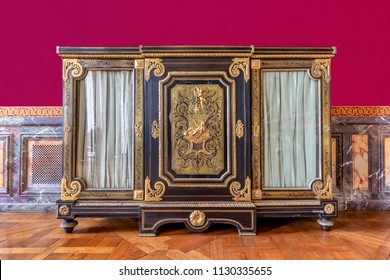 Golden And Mahogany Furniture In  The Royal Palace Of Versailles In France 