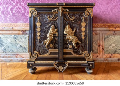 Golden And Mahogany Furniture In  The Royal Palace Of Versailles In France 