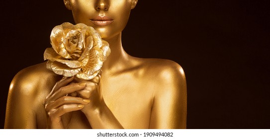 Golden Makeup Skin Fashion Model. Woman Glowing Face Perfect Portrait with Gold Rose Jewelry. Bodyart Painting