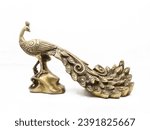 golden male peacock figurine with stand handcrafted and decorated with ornate details isolated in a white background