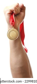 Golden Medal In Hand Isolated On White