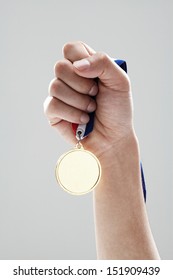 Golden Medal In Man Hand 