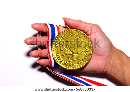 golden Medal, Winning, Victory in hand on white background.