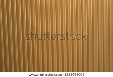 Golden Metal Corrugated Backdrop for an Ad Template.