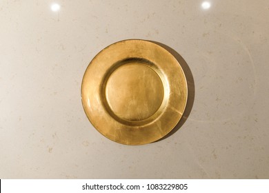 Golden Metal Plate On Light Table