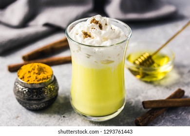 Golden milk honey ginger drink. Selective focus, space for text.