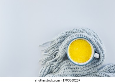 Golden Milk And On A Blue Background. Masala Haldi Doodh. Alternative Medicine Concept.