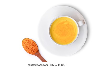 Golden Milk ( Turmeric Latte ) In White Ceramic Cup With Tumeric Powder Isolated On White Background. Top View. Flat Lay.