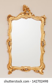Golden Mirror Frame On The Wall