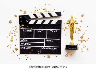 Golden Movie Award Statue With Cinema Clapper Board