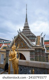 Golden Mythological figure in Wat Phra Kaew temple Bangkok Thailand.