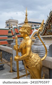 Golden Mythological figure in Wat Phra Kaew temple Bangkok Thailand.