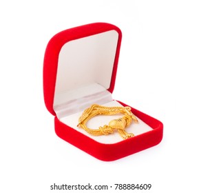 Golden Necklace With Heart Pendant On Red Velvet Box Isolated On White Background