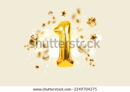 Golden number 1 is flying with golden confetti, gifts, mirror ball and stars balloons on a beige background with bokeh lights and sparks, creative idea. Winner and first place, concept.