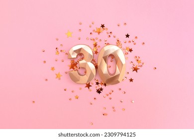 Golden number 30 and stars confetti on a pink pastel background. Creative concept. - Powered by Shutterstock