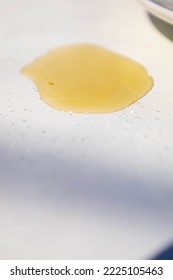 Golden Olive Oil Splash, Spilled In A White Cloth