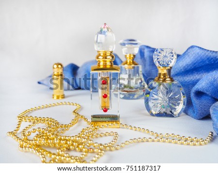 Golden oriental perfume bottle on white background.
