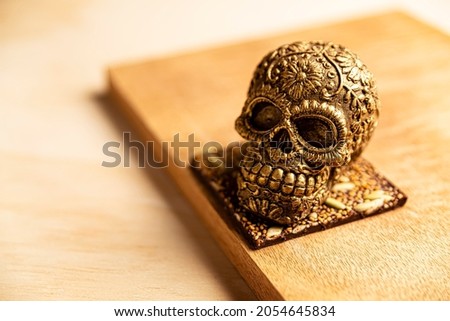 golden ornamented mexican skull made of chocolate gourmet, traditional gift for 