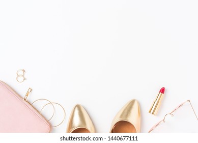 Women’s  golden outfit on white background. Top view - Shutterstock ID 1440677111