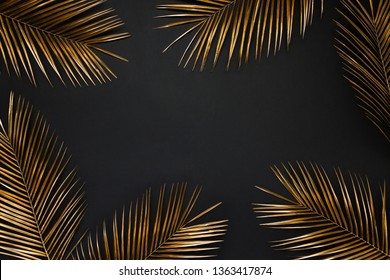 Golden painted date palm leaves creative border frame on dark black background isolated. Empty space, room for text. Minimalist style luxury wedding banner, invitation card template. - Powered by Shutterstock