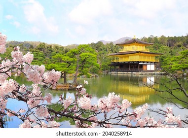 The Golden Pavilion (Kinkaku-ji Temple) and blooming sakura in Rokuon-ji complex (Deer Garden Temple), Kyoto, Japan. UNESCO world heritage site. Japanese hanami festival. Cherry blossoming season - Powered by Shutterstock