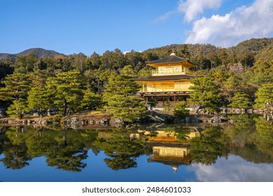 The Golden Pavilion of the Kinkakuji Temple by the pond surrounded with Japanese garden in Autumn season at Kyoto,Japan - Powered by Shutterstock