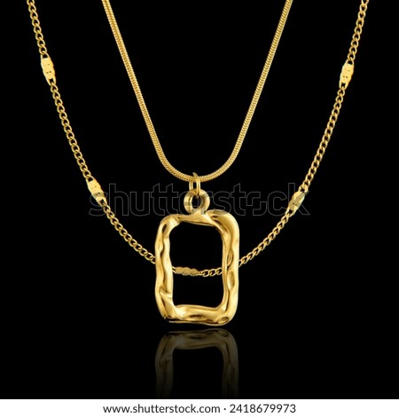 Golden pendant isolated on black background