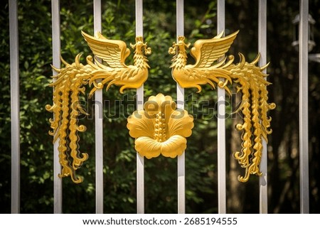 The golden phoenix pattern on the main gate of the Blue House in South Korea