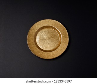 Golden Plate On A Dark Background