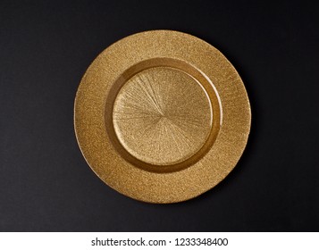 Golden Plate On A Dark Background