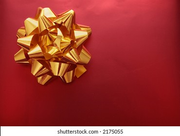 golden ribbon on a red gift Stock Photo