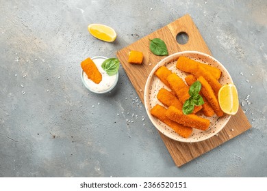 Golden roast Fish Sticks Fingers with sauce. banner, menu, recipe place for text, top view. - Powered by Shutterstock
