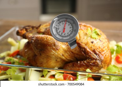 Golden Roasted Turkey With Meat Thermometer On Table