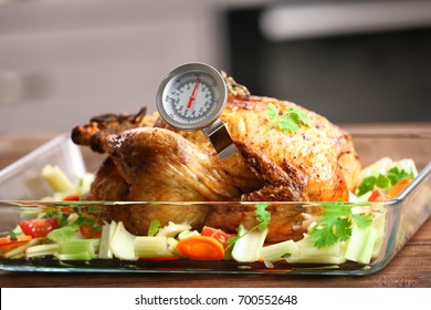 Golden Roasted Turkey With Meat Thermometer On Table