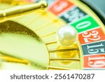 Golden roulette: A game of chance and fortune. A roulette wheel with a ball depicting the thrill and allure of gambling, the unpredictability and excitement associated with the game, found in casinos.