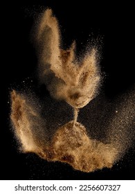 Golden sand clock shaped explosion , time running concept on black background - Shutterstock ID 2256607327
