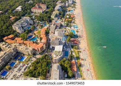 Golden Sands, Bulgaria - July 22, 2019: aerial image a drone. Resort on Black Sea coast. Many hotels and beaches with tourists, sunbeds and umbrellas. Travel and vacation concept. - Shutterstock ID 1549073453
