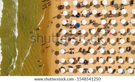 Similar – Aerial View From Flying Drone Of People Crowd Relaxing On Algarve Beach In Portugal