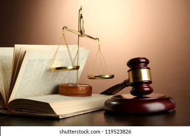 Golden Scales Of Justice, Gavel And Books On Brown Background