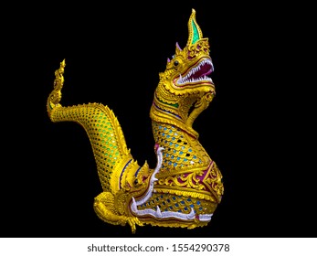 Golden serpent king or king of naga statue isolated on black background - clipping paths. Sculpture of serpent. An ancient temple Lanna style architecture. 