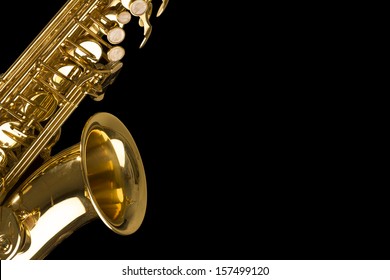 golden shiny saxophone on black background - Shutterstock ID 157499120