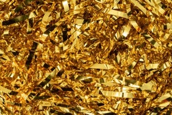 Golden Shiny Tinsel Ribbons. Golden Sequins, Sparkling Stripes Of Serpentine. Festive Decor For New Year, Birthday, Party. Background For The Holiday. Heap Of Glowing Tinsel Close Up. Top View.