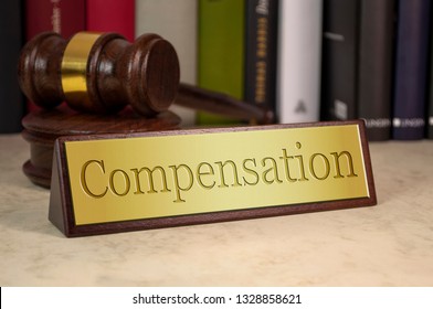 Golden sign with gavel and compensation - Shutterstock ID 1328858621