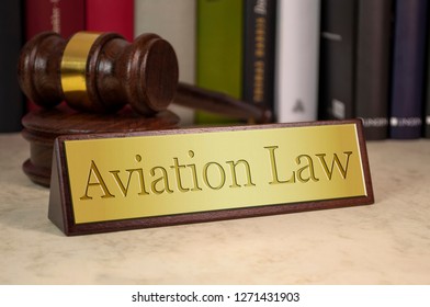 Golden Sign With Gavel And Law Books And Aviation Law