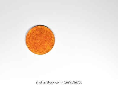 Golden Silica Gel Dessicant In A Small Dish On A White Background