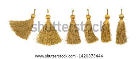 Golden silk tassels isolated on white background for creating graphic concepts