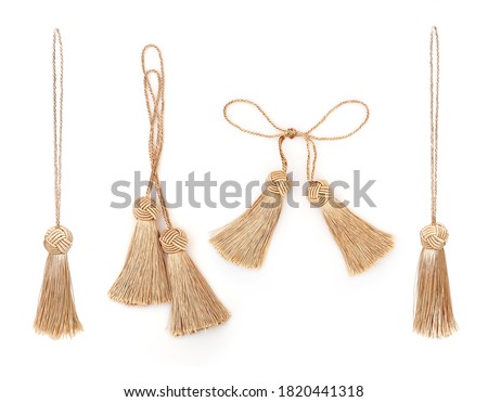 Golden silk tassels isolated on white background for creating graphic concepts