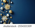 Golden and silver Christmas decorations on a blue background. Xmas greeting card template. Flat lay, top view, copy space. 